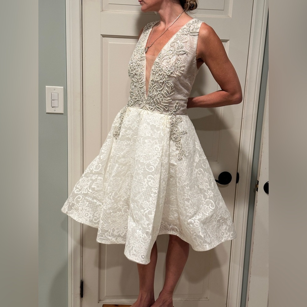 Sleeveless White Lace A-Line Wedding Dress with Plunging V-Neck